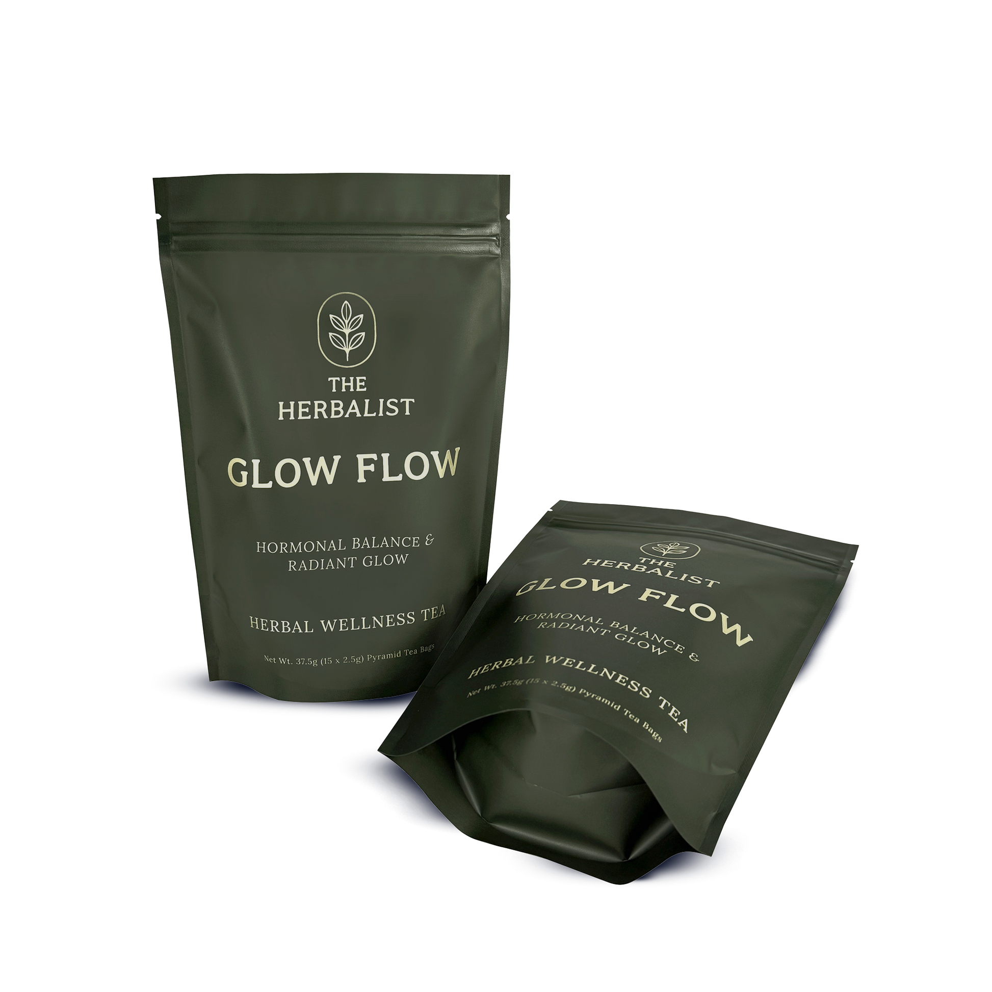 Pyramid tea bag of Glow Flow herbal infusion steeping in hot water with spearmint, chamomile, rose petals, and ashwagandha